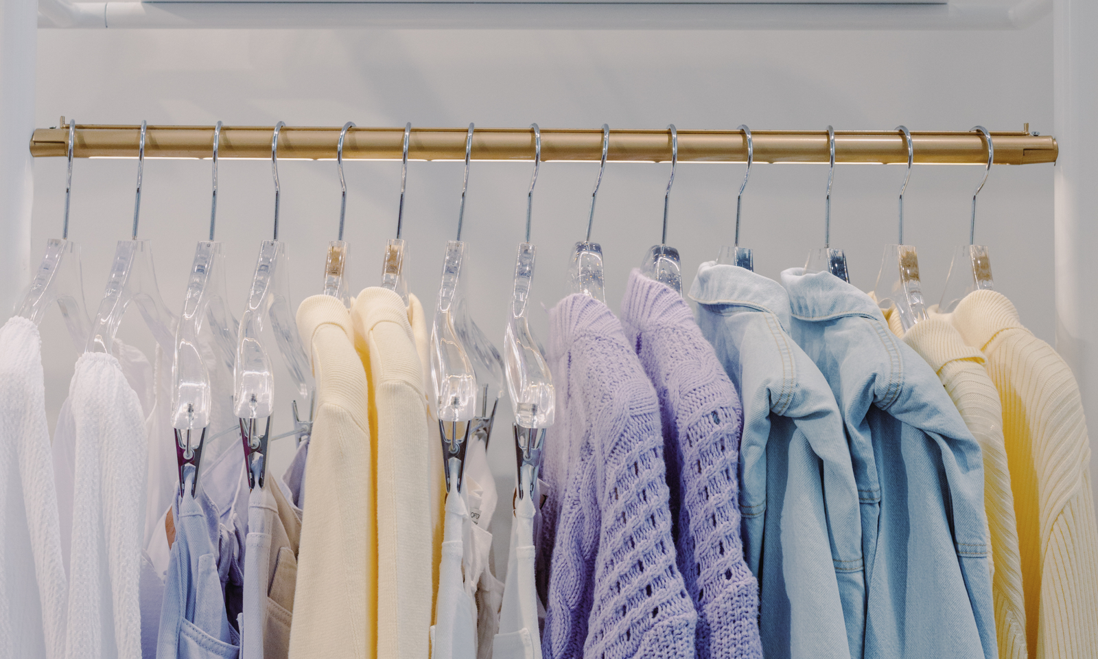 A sleek, modern clothes hanger displaying stylish apparel in a boutique clothing store.